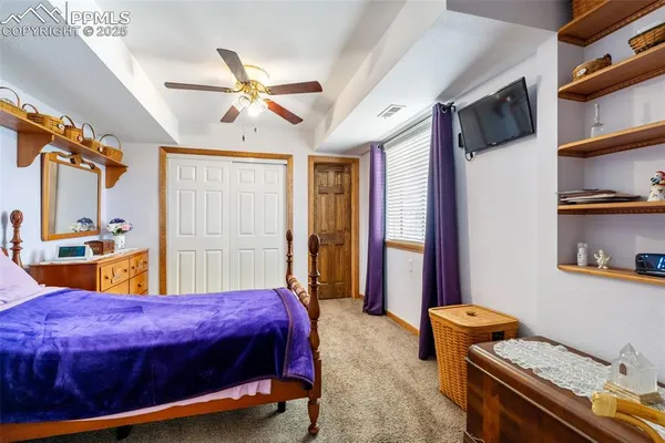 a bed room with a bed and a window