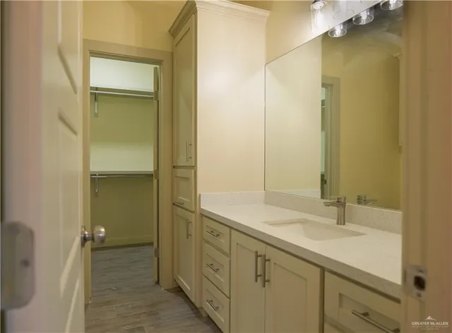 a bathroom with a sink and a mirror