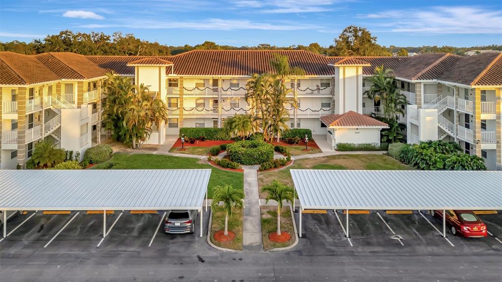 an aerial view of a house with a yard