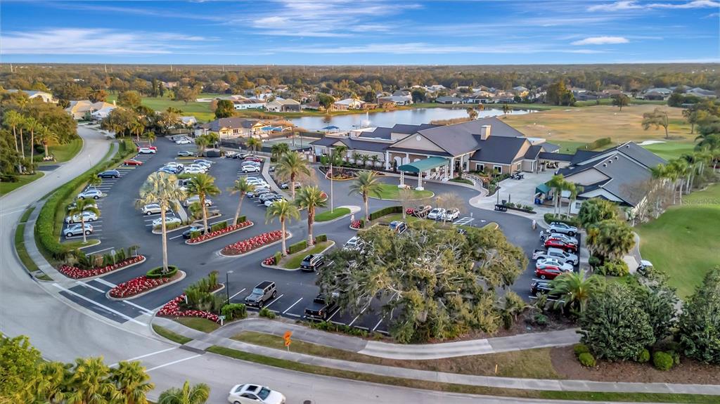 6507 Stone River Road, Unit 105 Bradenton, FL 34203 - Photo 18 of 62 an aerial view of residential houses with outdoor space