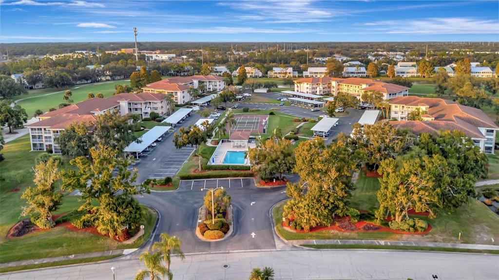 6507 Stone River Road, Unit 105 Bradenton, FL 34203 - Photo 19 of 62 an aerial view of residential houses with outdoor space