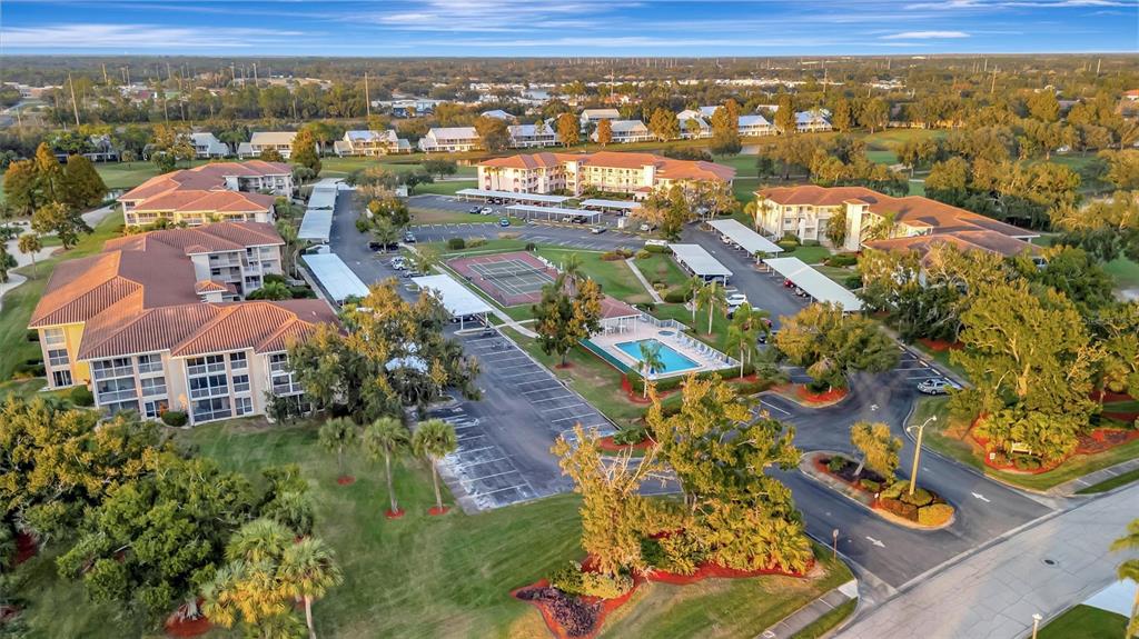 6507 Stone River Road, Unit 105 Bradenton, FL 34203 - Photo 20 of 62 an aerial view of residential building with parking