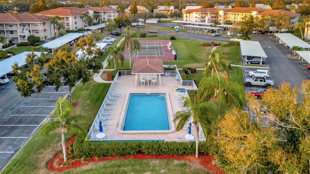 6507 Stone River Road, Unit 105 Bradenton, FL 34203 - Photo 22 of 62 an aerial view of a house with a garden