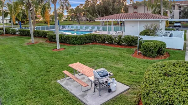 a view of a dining room with furniture and a window