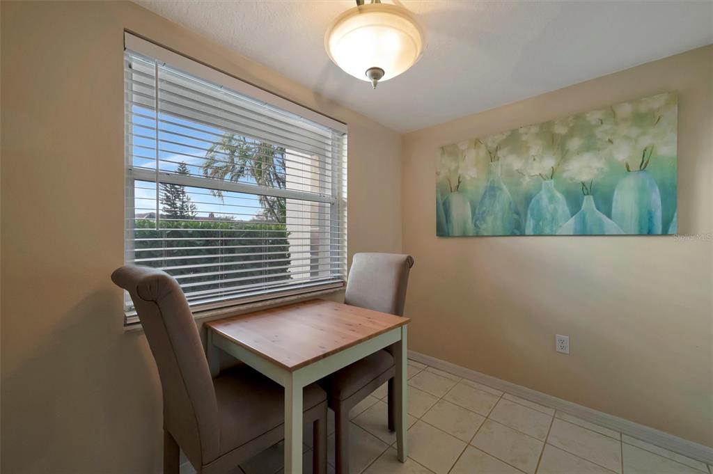6507 Stone River Road, Unit 105 Bradenton, FL 34203 - Photo 29 of 62 a view of a room that has a window and wooden floor