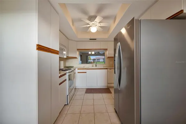 a view of a dining room with furniture wooden floor and a chandelier