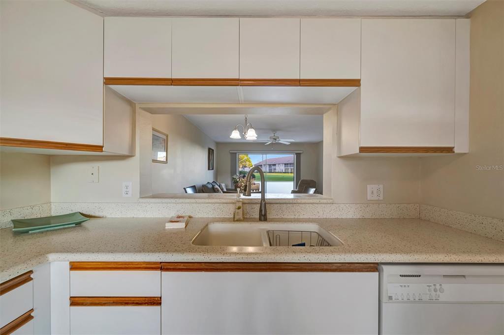 6507 Stone River Road, Unit 105 Bradenton, FL 34203 - Photo 36 of 62 a kitchen with a sink and cabinets