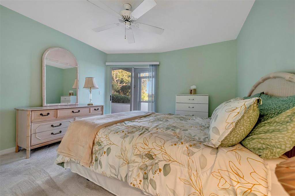 6507 Stone River Road, Unit 105 Bradenton, FL 34203 - Photo 49 of 62 a bedroom with a bed and a dresser