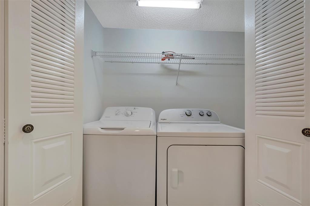 6507 Stone River Road, Unit 105 Bradenton, FL 34203 - Photo 56 of 62 a utility room with dryer and washer