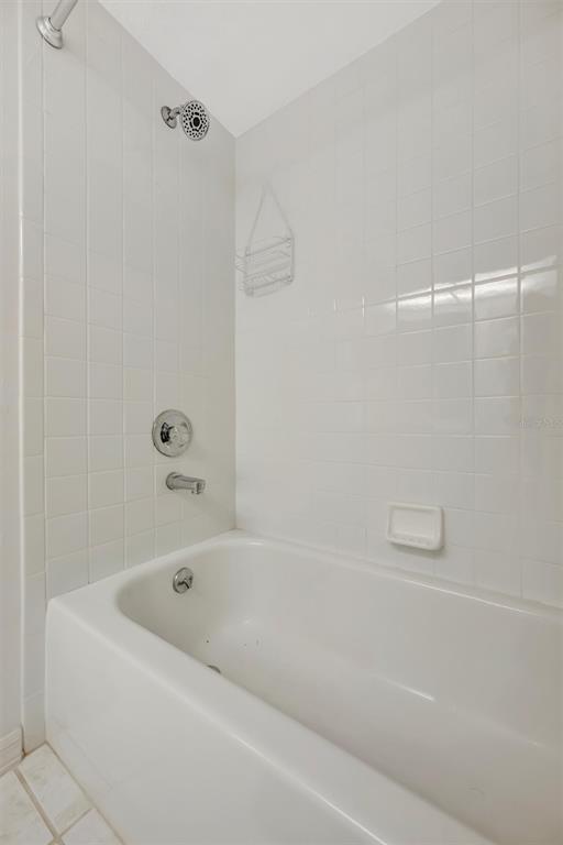 6507 Stone River Road, Unit 105 Bradenton, FL 34203 - Photo 59 of 62 a bathroom with a bathtub