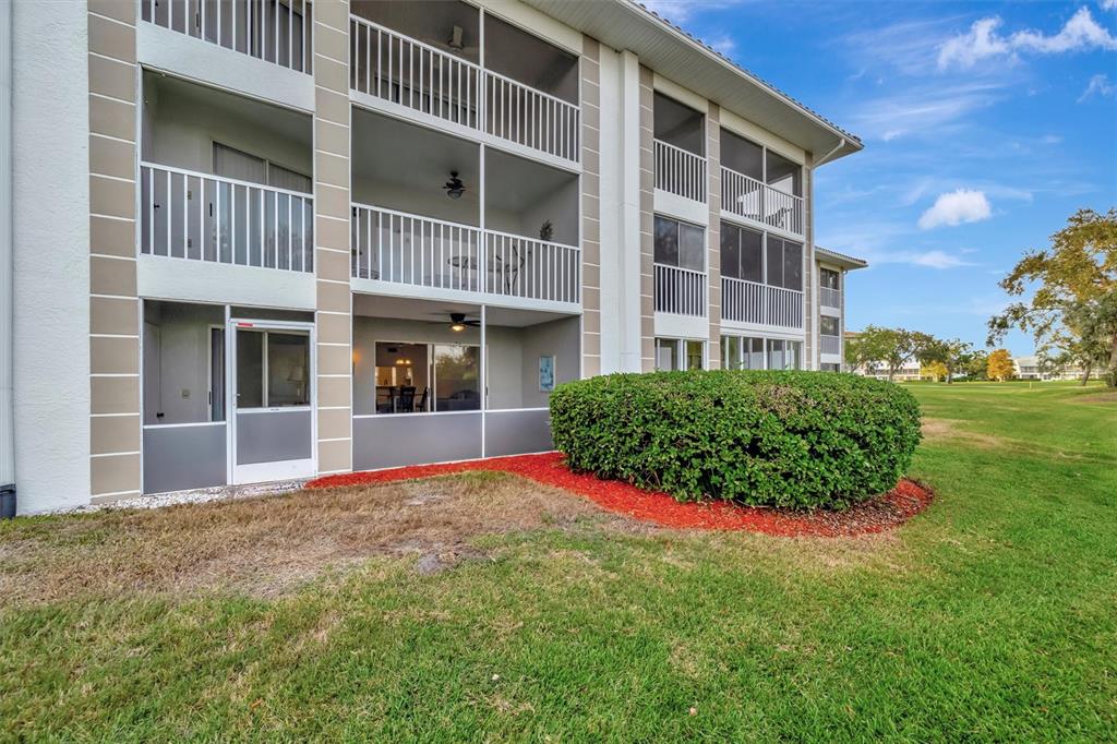 6507 Stone River Road, Unit 105 Bradenton, FL 34203 - Photo 61 of 62 a view of building with yard