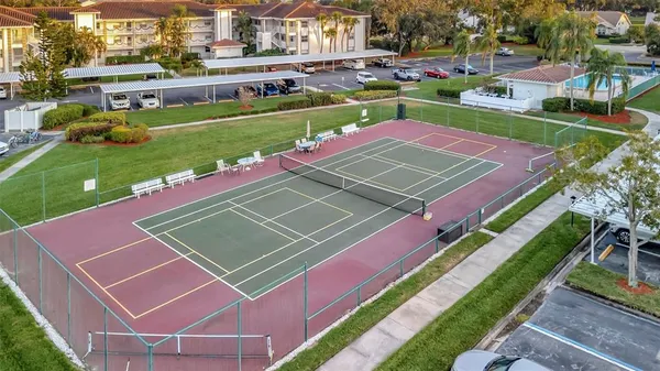 a view of a swimming pool with a lounge chairs