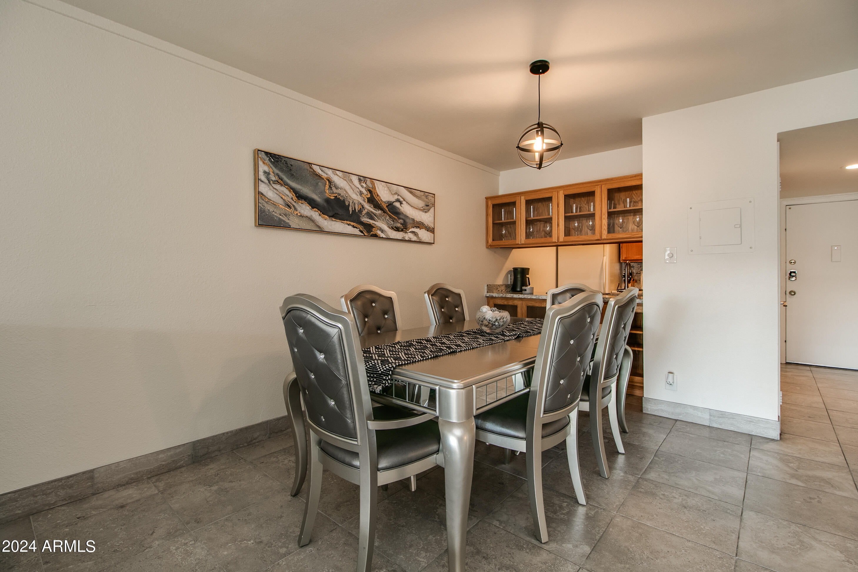 7625 East Camelback Road, Unit 252B Scottsdale, AZ 85251 - Photo 14 of 26 a view of a dining room with furniture and window