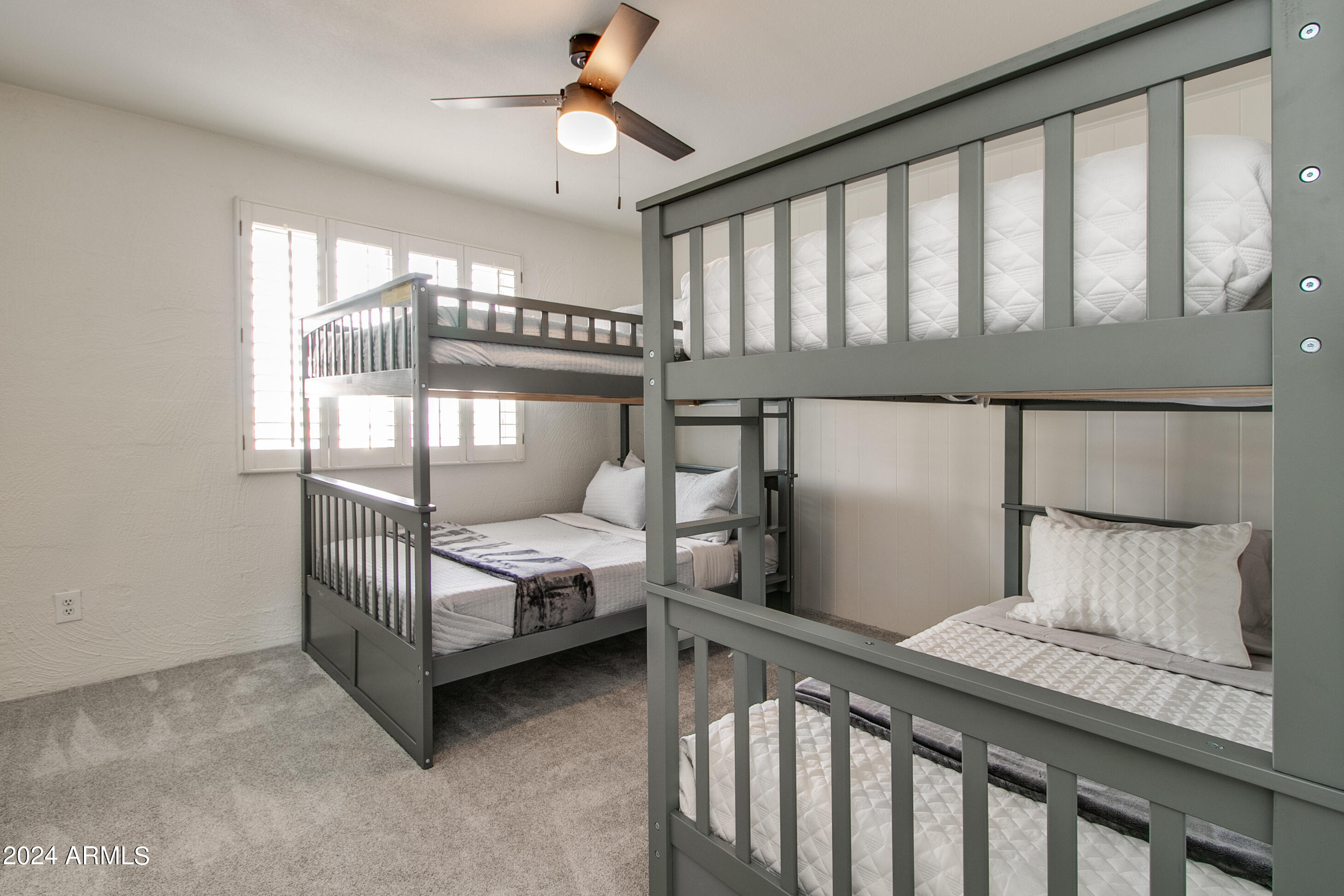 7625 East Camelback Road, Unit 252B Scottsdale, AZ 85251 - Photo 20 of 26 a bedroom with a bed and a window