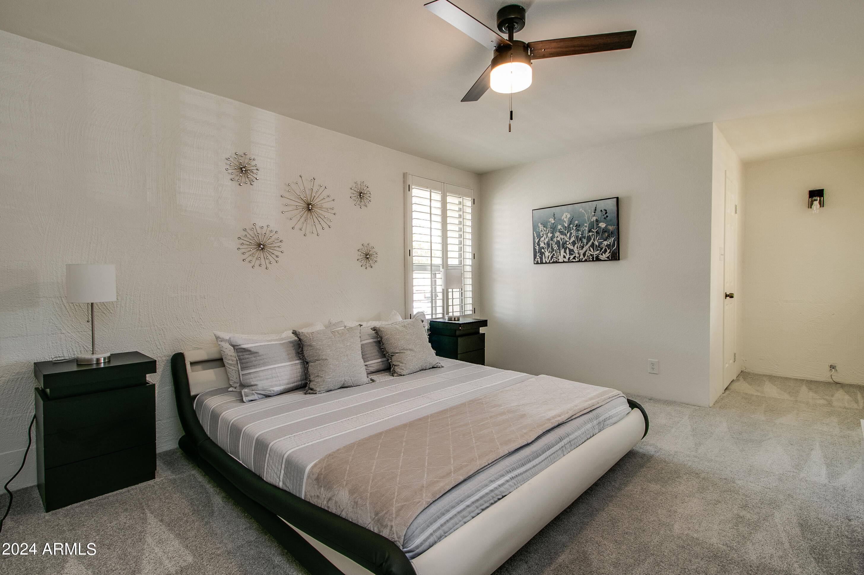 7625 East Camelback Road, Unit 252B Scottsdale, AZ 85251 - Photo 23 of 26 a bedroom with a bed and a window
