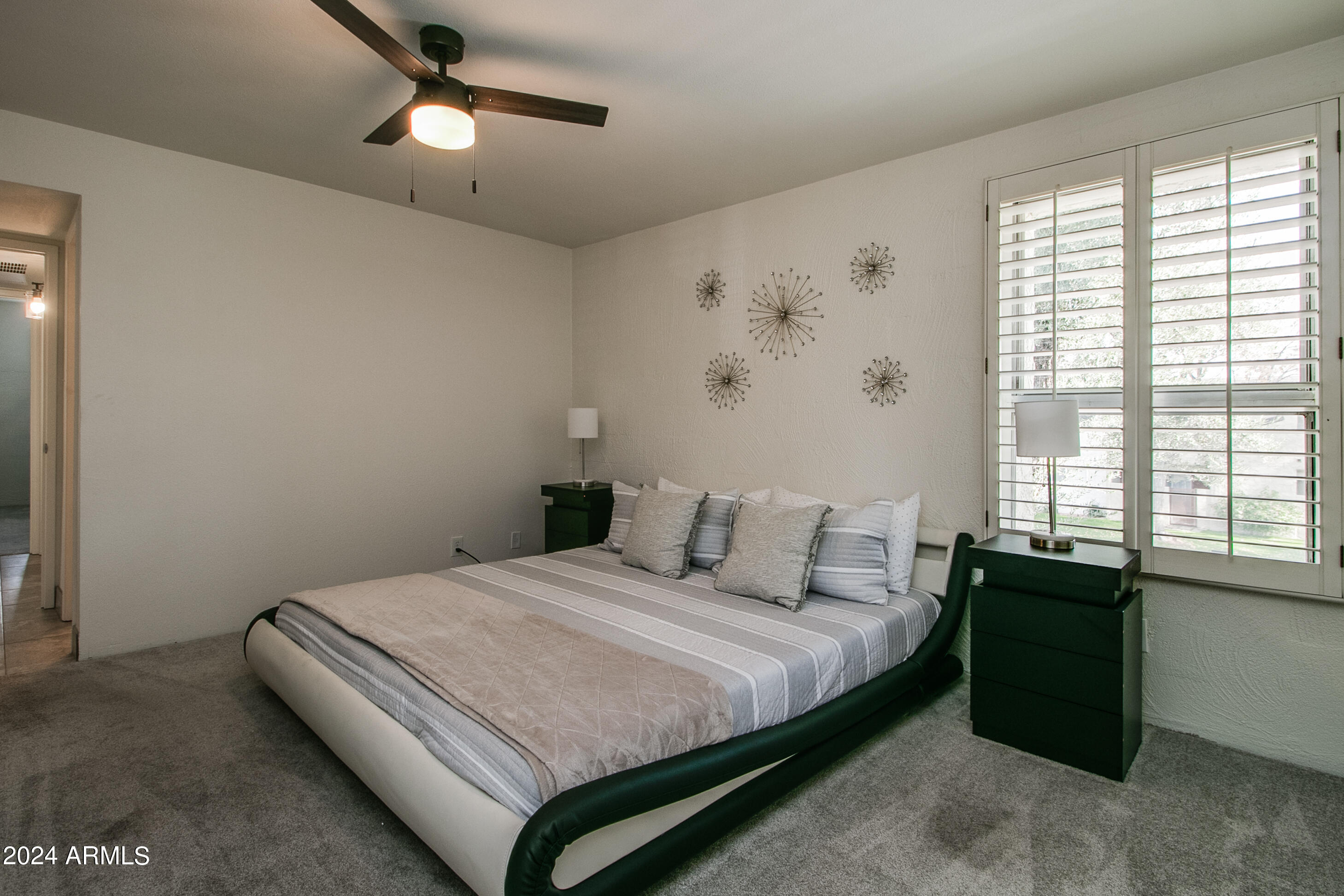 7625 East Camelback Road, Unit 252B Scottsdale, AZ 85251 - Photo 24 of 26 a bedroom with a bed and a window