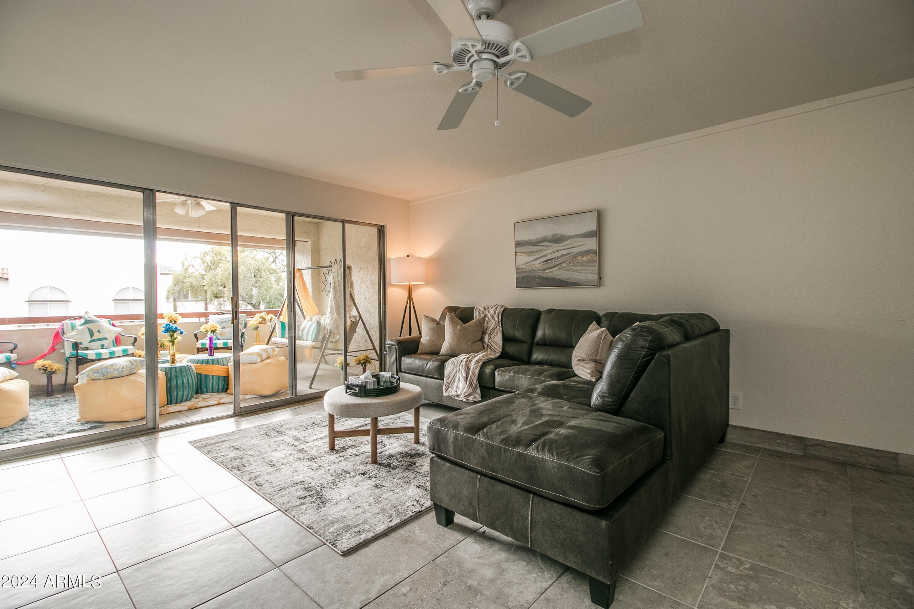 7625 East Camelback Road, Unit 252B Scottsdale, AZ 85251 - Photo 5 of 26 a living room with furniture and a large window