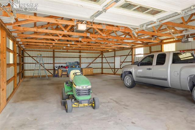 8155 Soap Weed Road Calhan, CO 80808 - Photo 32 of 39 Garage with a garage door opener