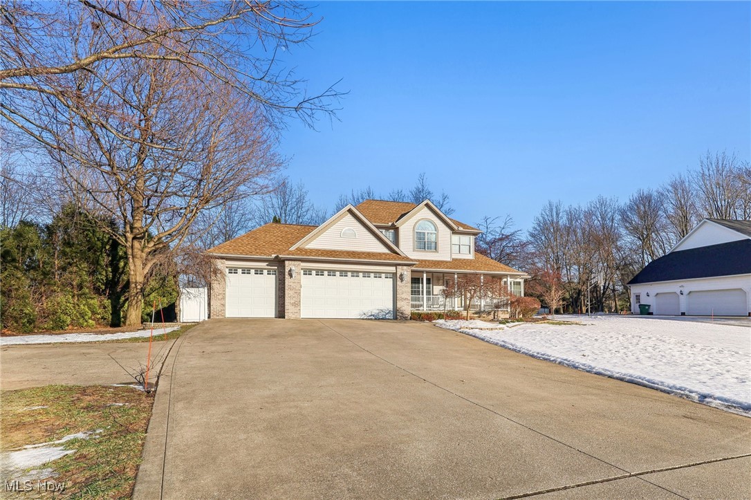 3353 Jens Way Perry, OH 44081 - Photo 2 of 49 View of front of house with a porch and a garage