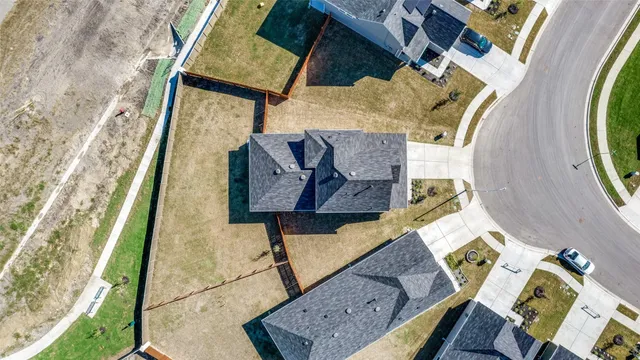 a bathroom with a granite countertop toilet and a sink