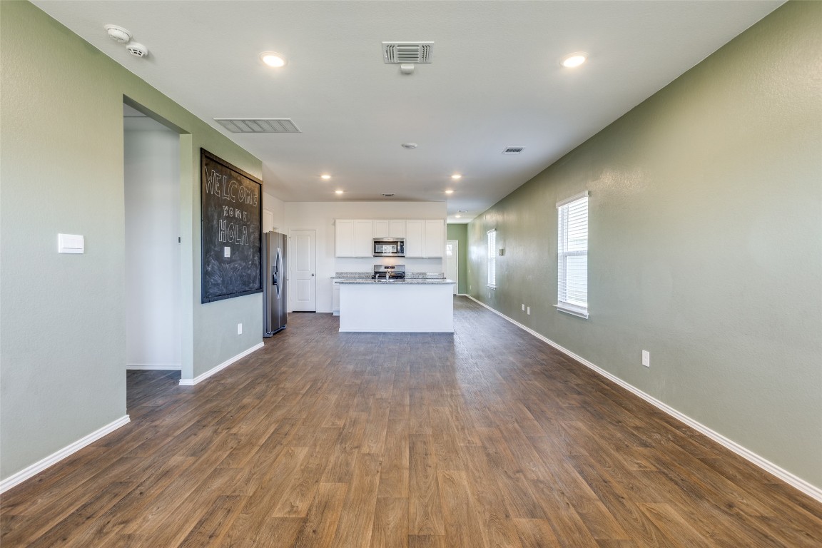 543 Sandringham Loop Kyle, TX 78640 - Photo 19 of 20 a view of a kitchen with a sink and a refrigerator