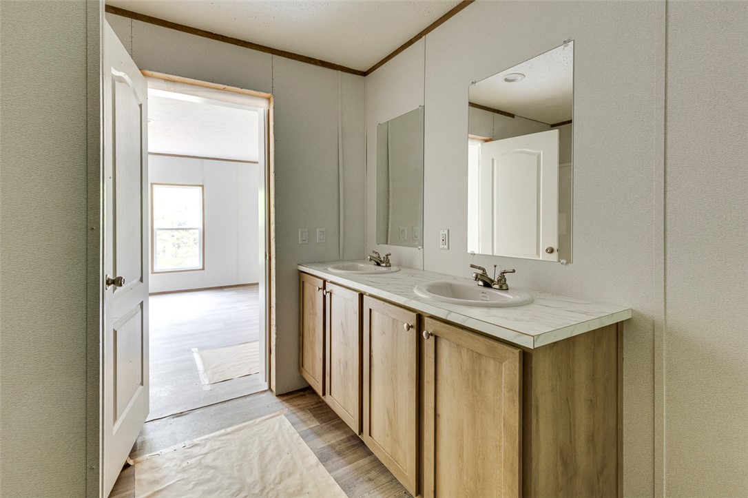 474 Bryant Road Pelzer, SC 29669 - Photo 26 of 42 Double vanity with ample cabinet storage creates a practical and convenient bathroom space.