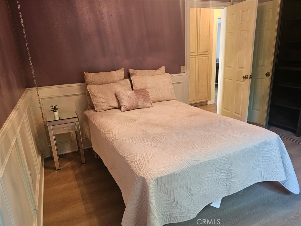 25132 Highspring Avenue Newhall, CA 91321 - Photo 17 of 46 a bed sitting in a bedroom next to a window