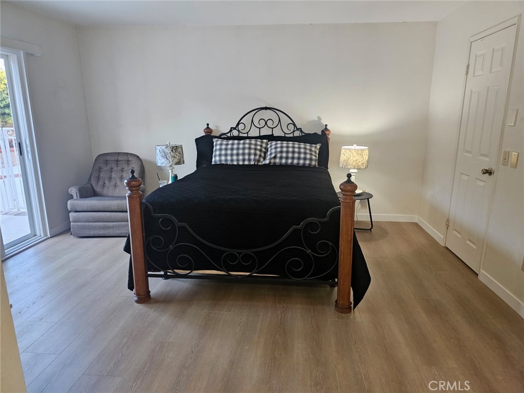 25132 Highspring Avenue Newhall, CA 91321 - Photo 20 of 46 a bedroom with a bed and a window