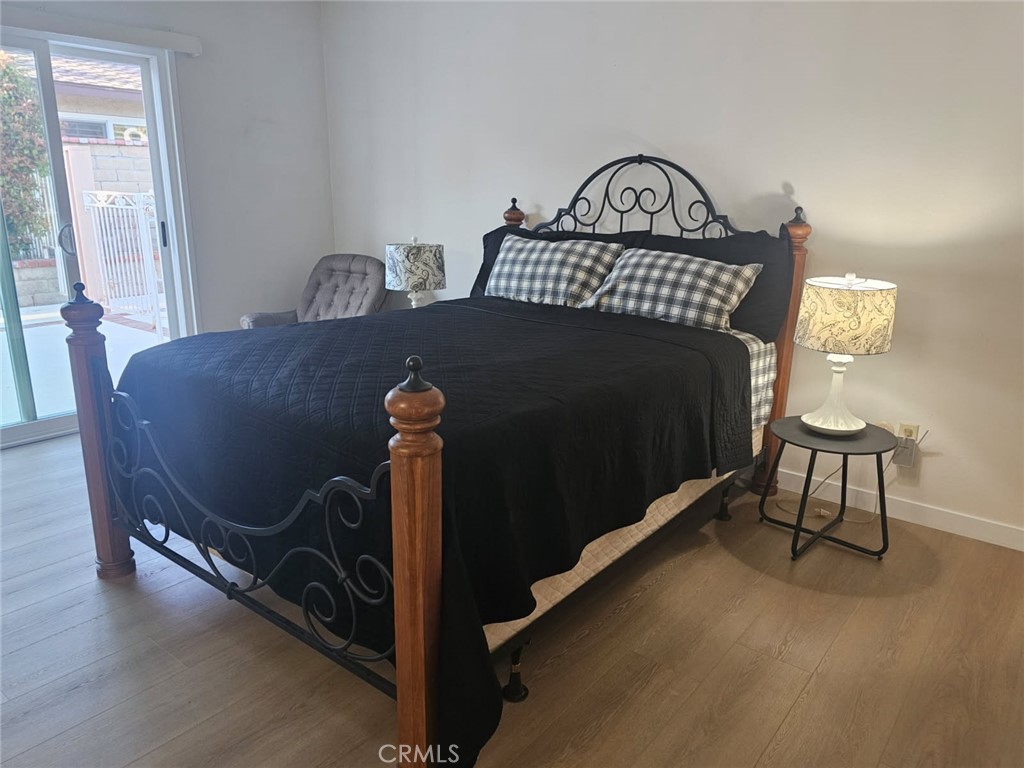 25132 Highspring Avenue Newhall, CA 91321 - Photo 21 of 46 a bedroom with a bed and a window