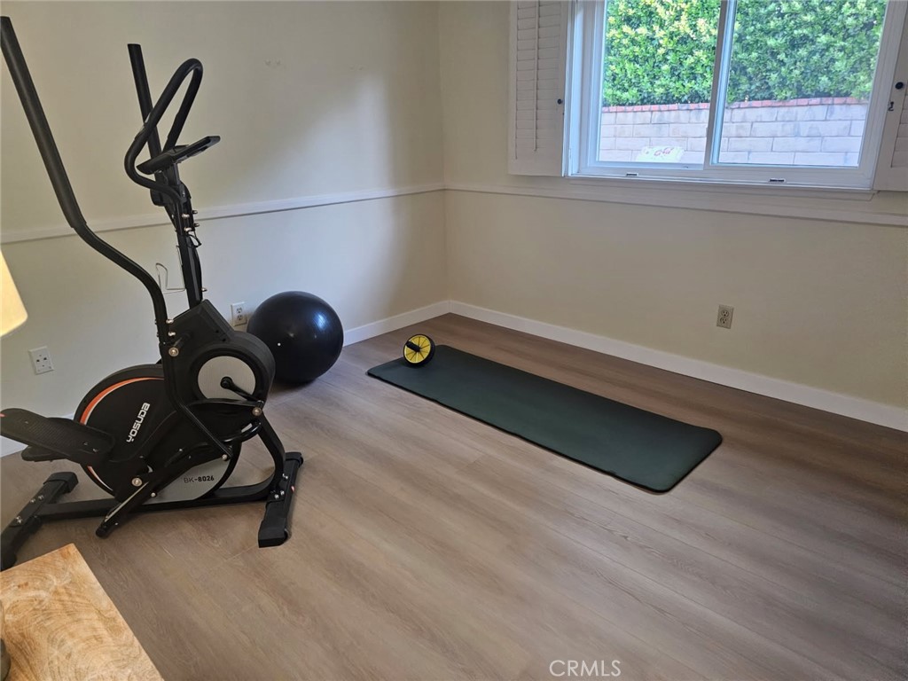 25132 Highspring Avenue Newhall, CA 91321 - Photo 27 of 46 a view of a room with gym equipment and a window