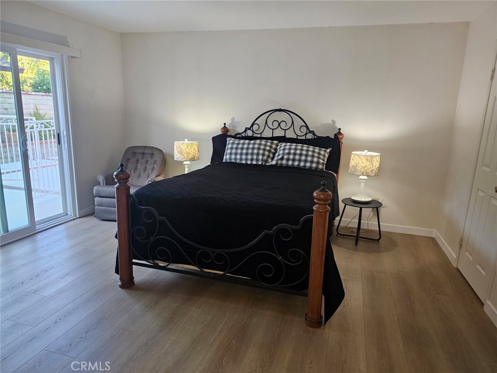 25132 Highspring Avenue Newhall, CA 91321 - Photo 31 of 46 a bedroom with a bed and a window