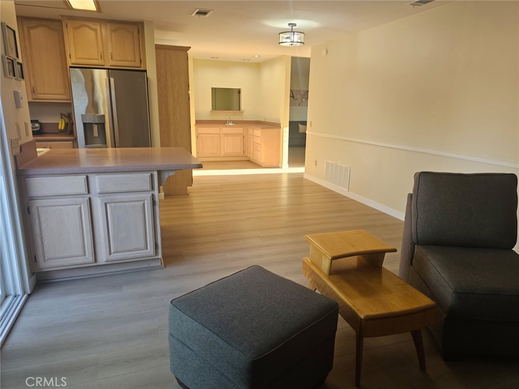 25132 Highspring Avenue Newhall, CA 91321 - Photo 8 of 46 a view of kitchen with furniture and wooden floor