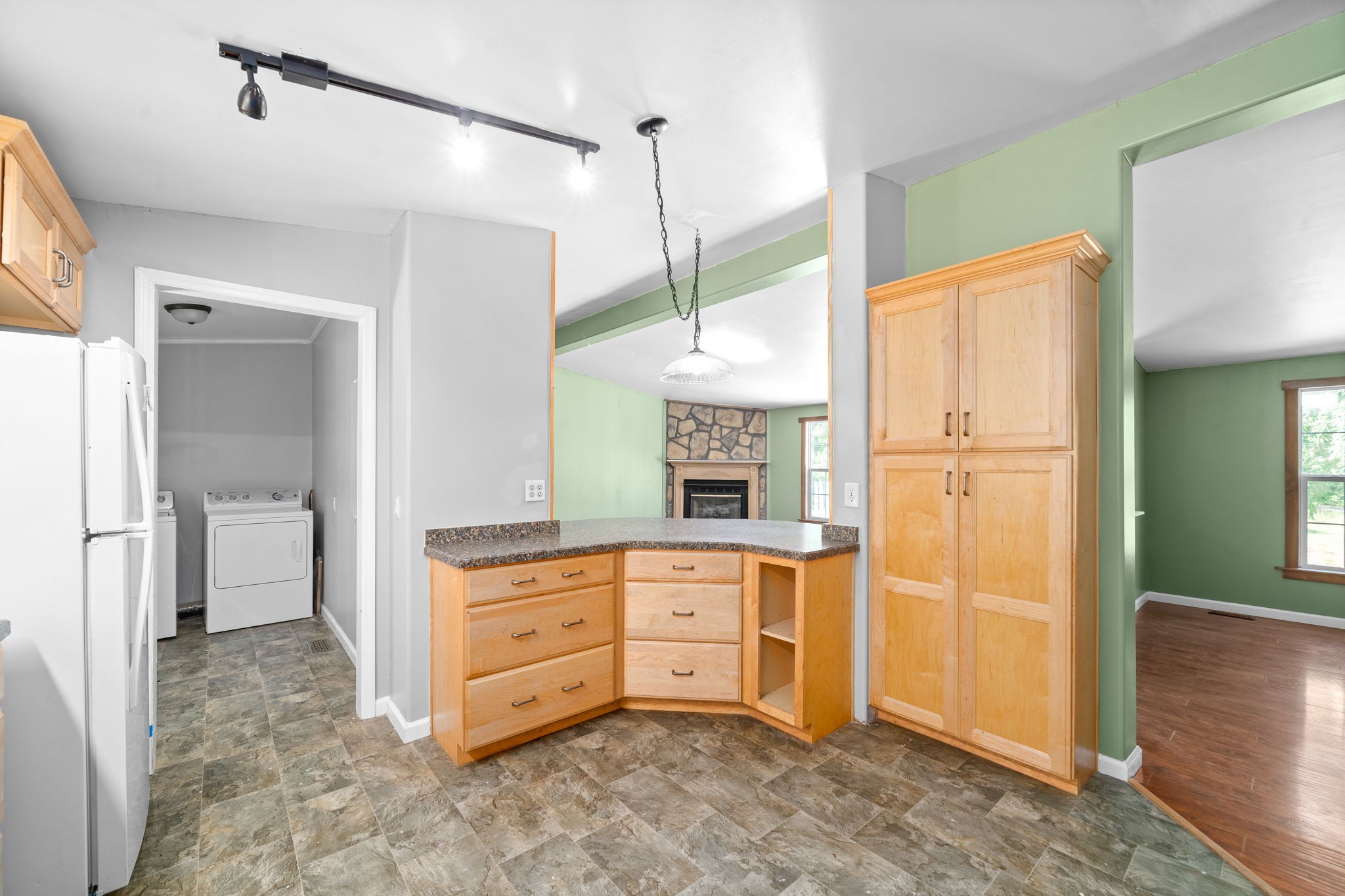 107 Holland Road Dickson, TN 37055 - Photo 13 of 31 a room with a dresser and a chandelier