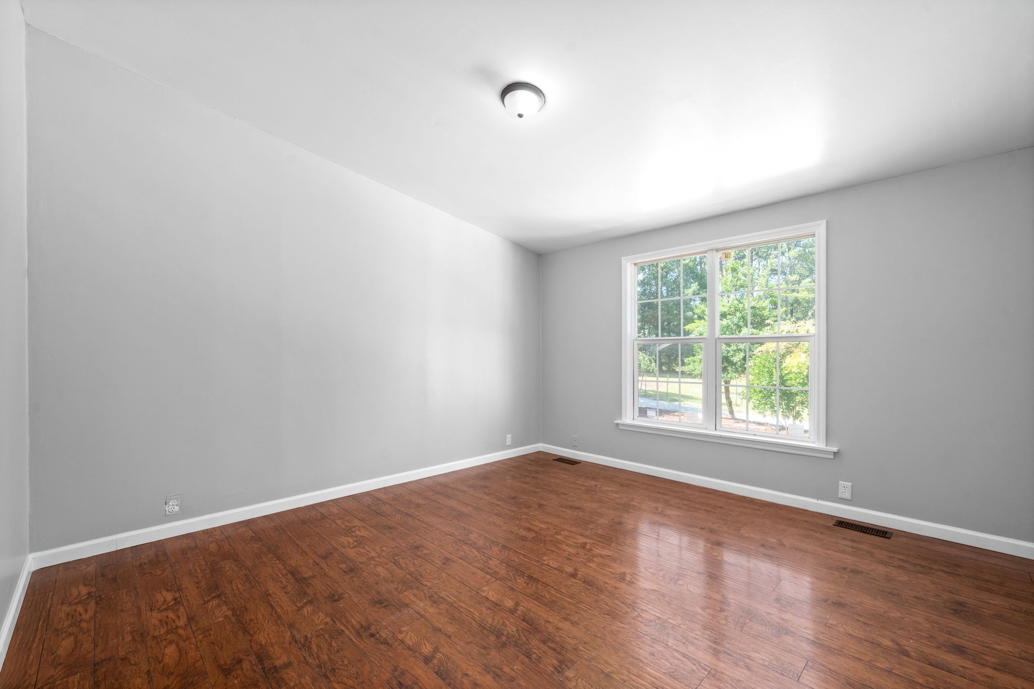 107 Holland Road Dickson, TN 37055 - Photo 15 of 31 an empty room with wooden floor and windows