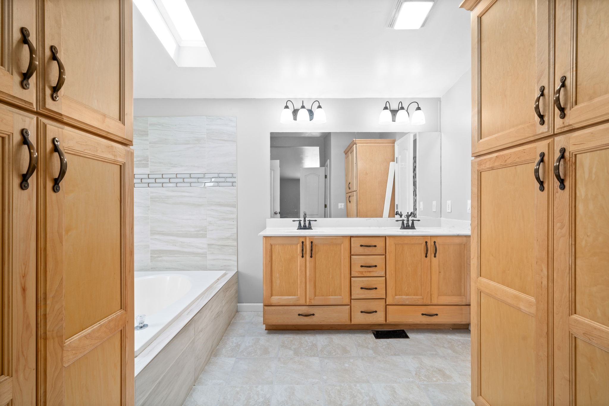 107 Holland Road Dickson, TN 37055 - Photo 19 of 31 a bathroom with a bathtub sink and mirror