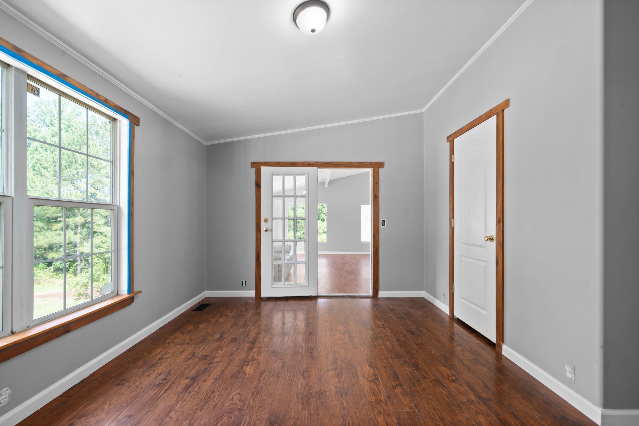 107 Holland Road Dickson, TN 37055 - Photo 23 of 31 a view of an empty room with wooden floor and a window