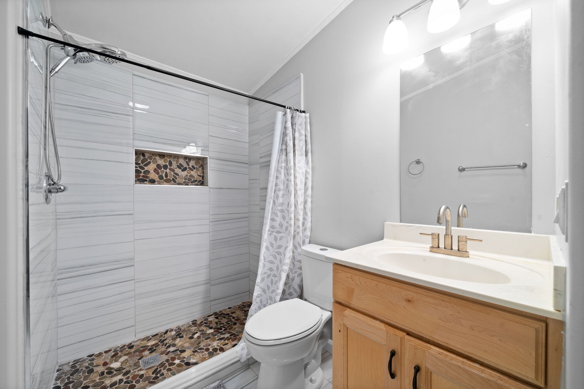 107 Holland Road Dickson, TN 37055 - Photo 24 of 31 a bathroom with a sink a toilet a shower and a mirror