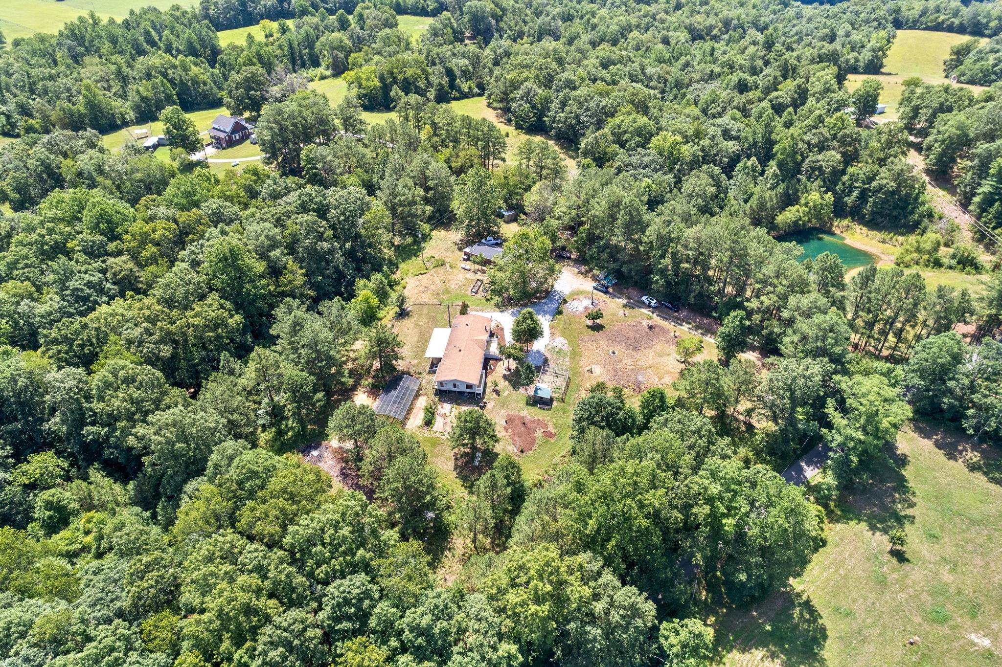 107 Holland Road Dickson, TN 37055 - Photo 30 of 31 view of a house with a lush green forest