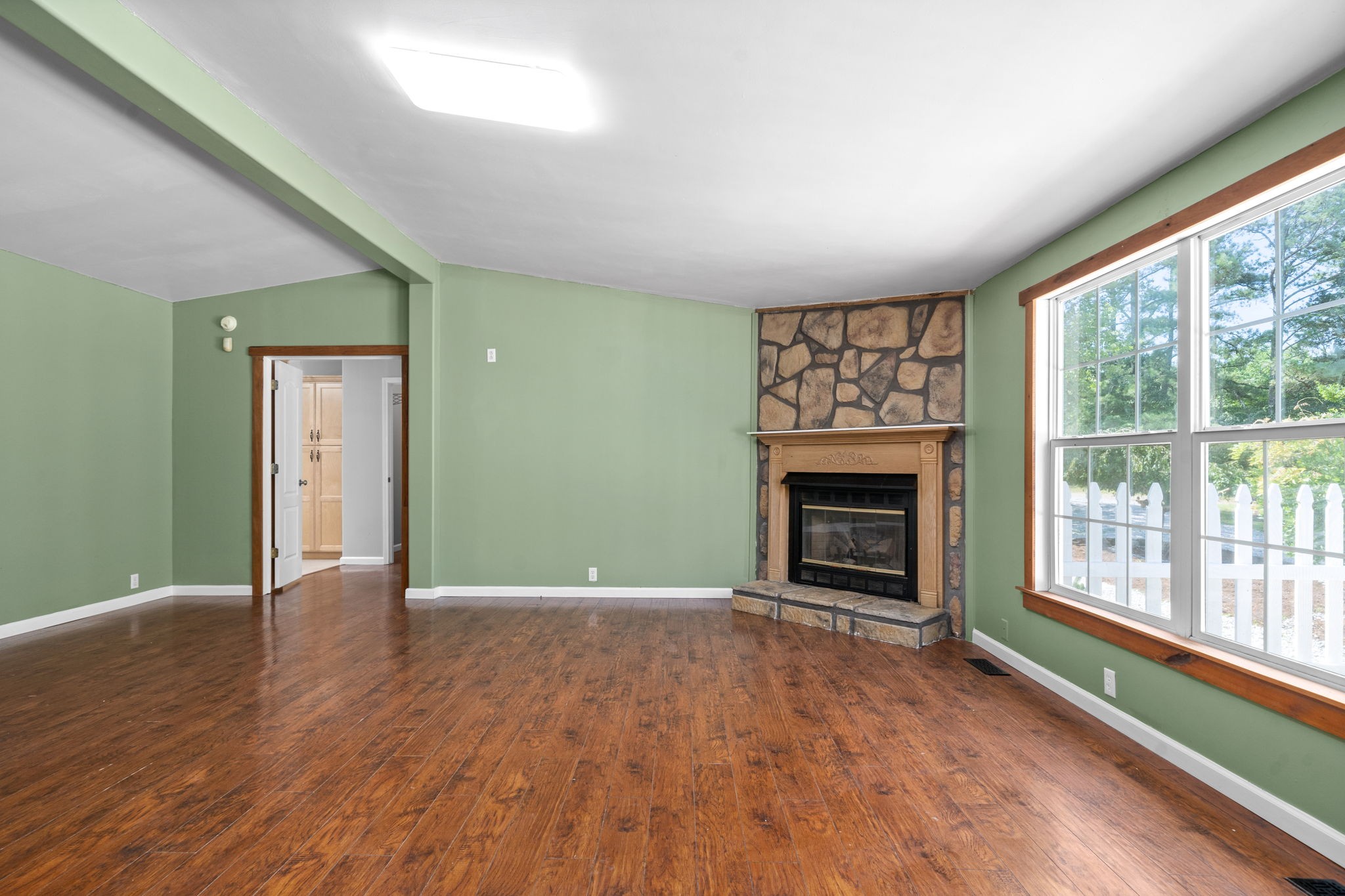 107 Holland Road Dickson, TN 37055 - Photo 3 of 31 a view of an empty room with a window and fireplace