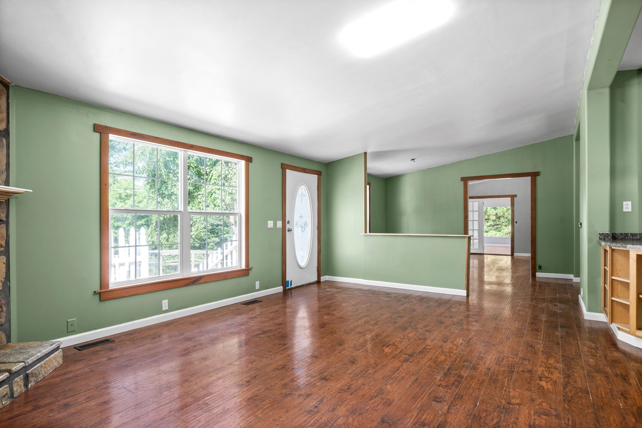 107 Holland Road Dickson, TN 37055 - Photo 5 of 31 an empty room with wooden floor and windows