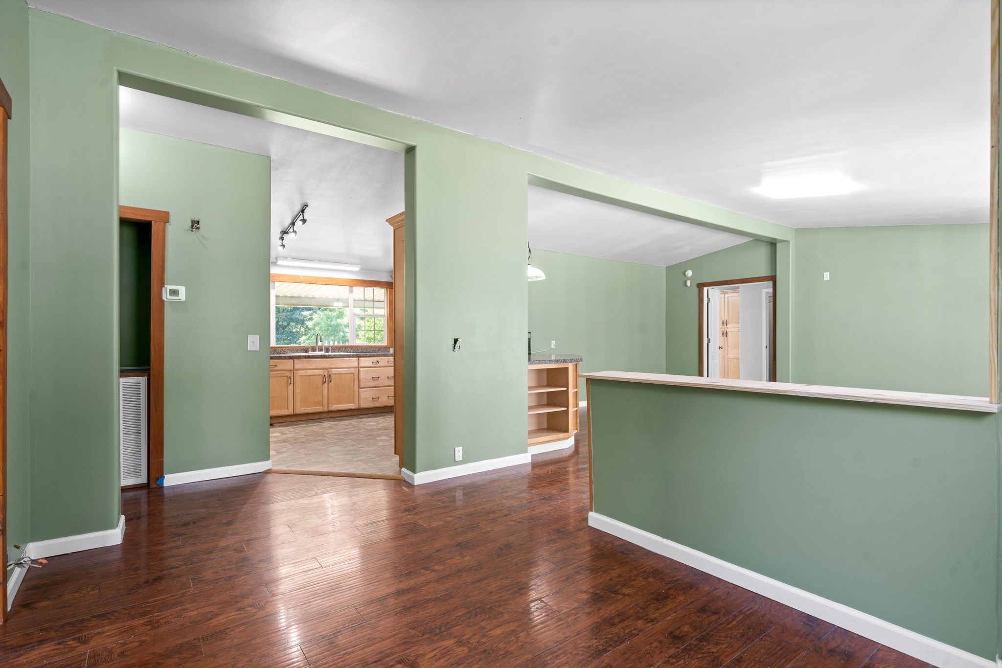 107 Holland Road Dickson, TN 37055 - Photo 8 of 31 an empty room with wooden floor and windows