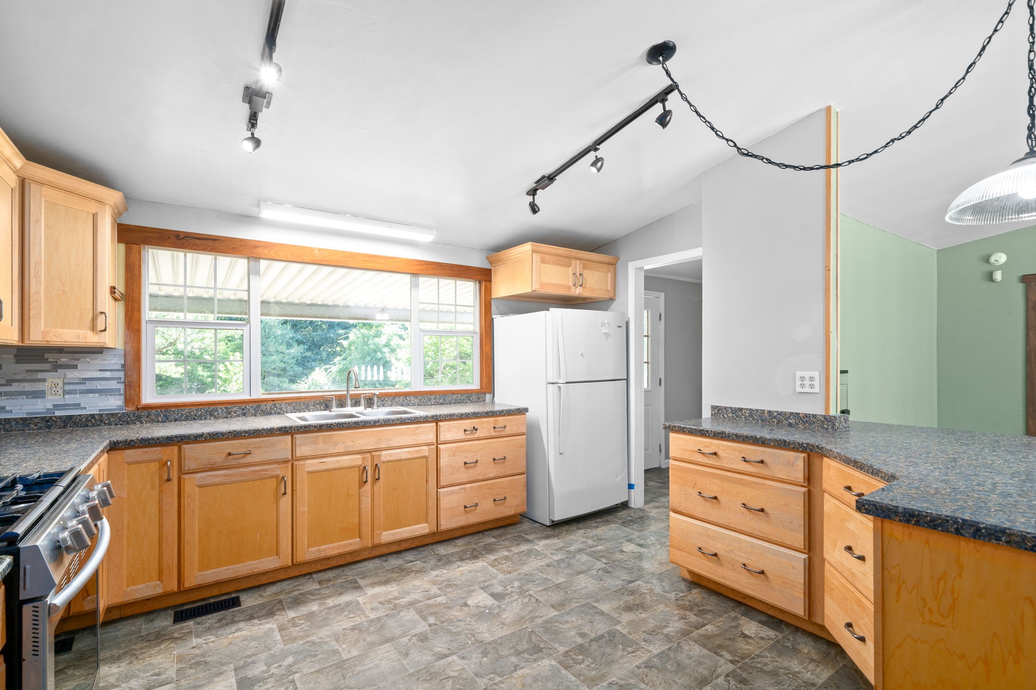 107 Holland Road Dickson, TN 37055 - Photo 10 of 31 a kitchen with sink cabinets and window
