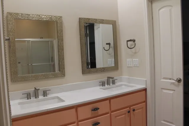 a bathroom with a sink and mirror