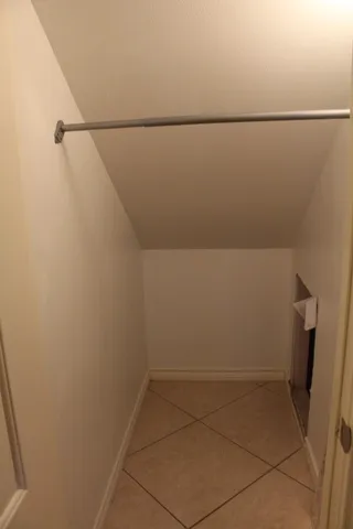 a view of a room with an empty walk in closet