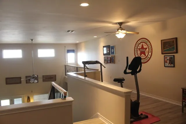 a view of living room with furniture and a chandelier