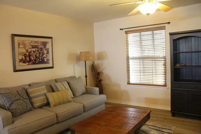 a living room with furniture and a window