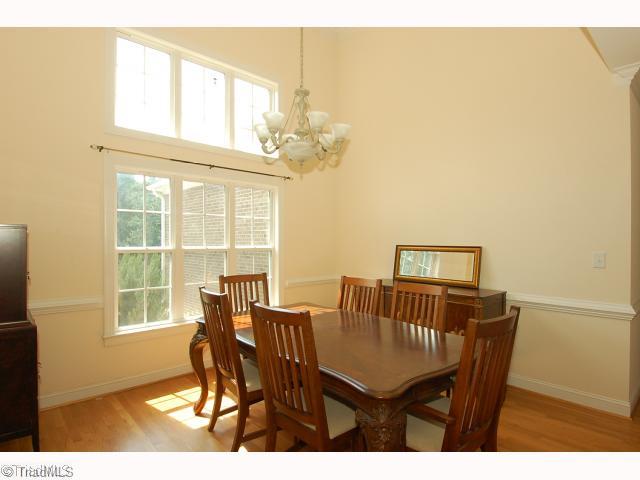2693 Weymoth Road Winston-Salem, NC 27103 - Photo 3 of 12 Dining Room. Dining Room has been freshly painted; features vaulted ceiling, hardwood floor, beautiful windows for light filled room.