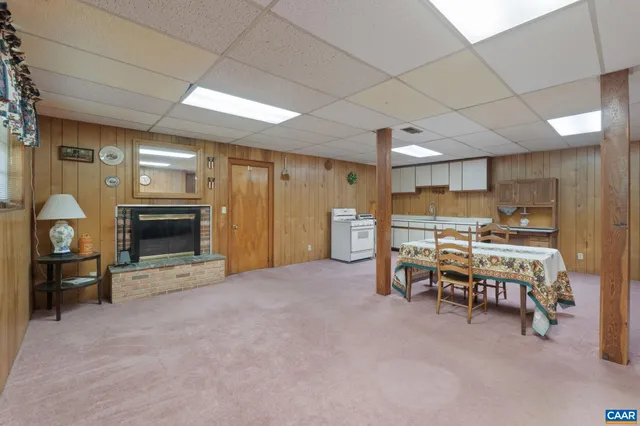 a view of a livingroom with furniture and a fireplace