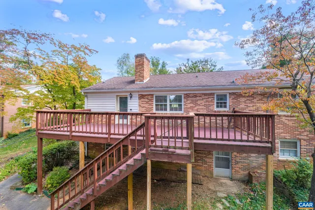 a view of deck with wooden floor and fence