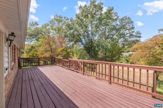 a backyard of a house with a yard and outdoor seating